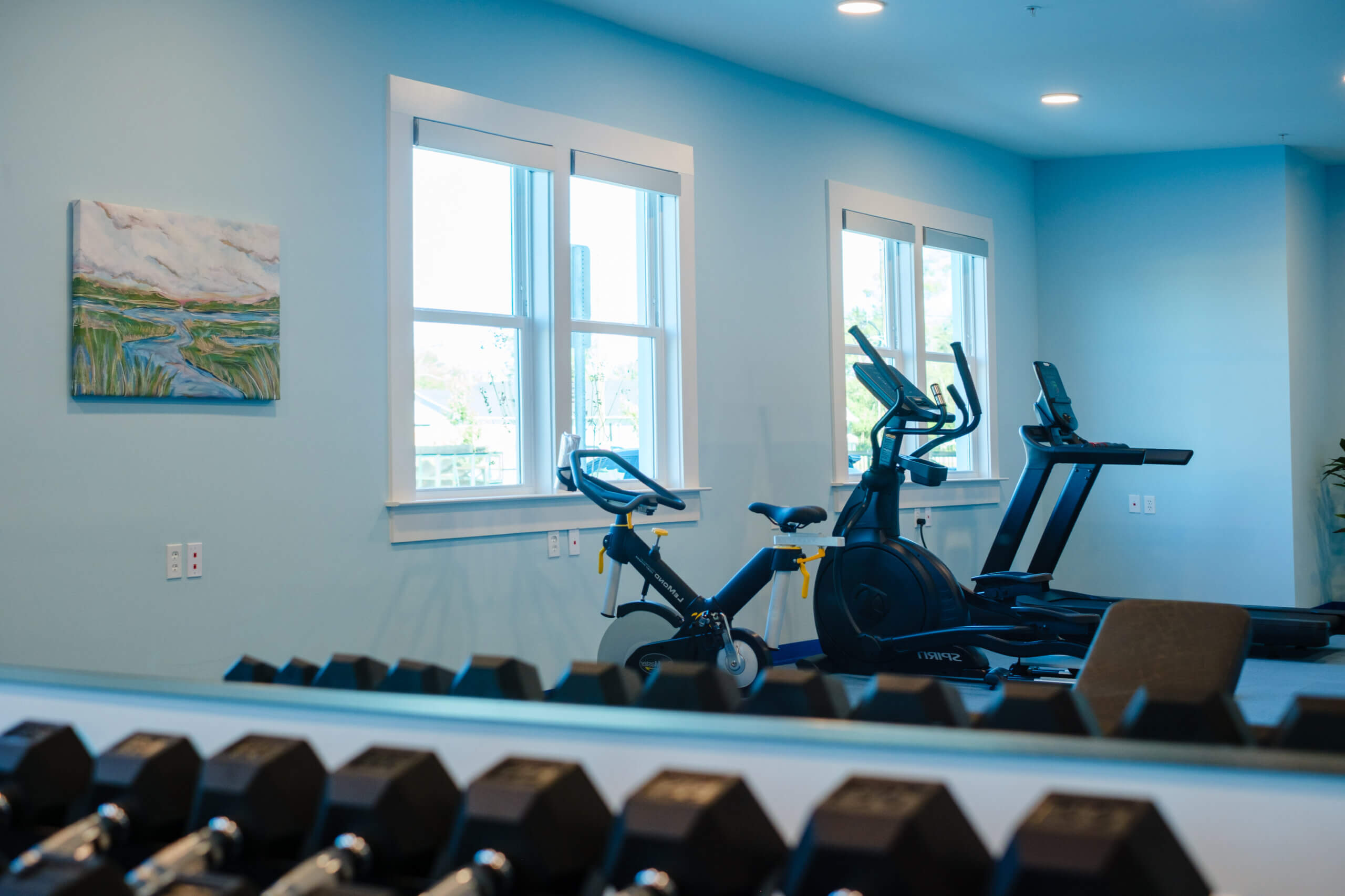 On-site fitness center with exercise equipment at Mid City Lofts