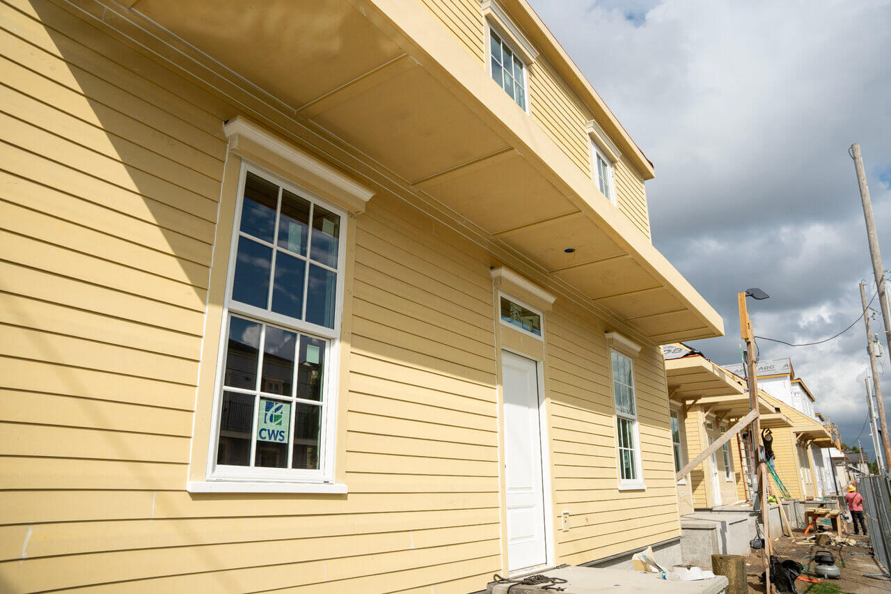Newly constructed homes at Lafitte Phase VII with completed siding and exterior details